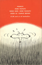 Load image into Gallery viewer, The back cover of the book featuring an orange and white circular design resembling a rising or setting sun behind Snoopy in a field of tall grass. A list of additional Peanuts titles is printed in white near the top, along with the original retail price of $1.00 each.