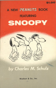 A New Peanuts Book Featuring Snoopy. [Signed by Schulz with an Original Sketch of Snoopy]